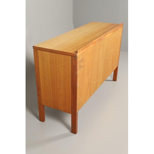 589 - MID CENTURY TEAK SIDEBOARD - MANN EGERTON, 1977. An interesting teak sideboard with a small raised b... 