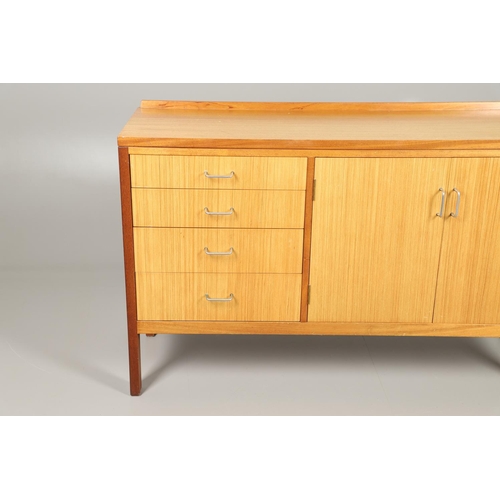 589 - MID CENTURY TEAK SIDEBOARD - MANN EGERTON, 1977. An interesting teak sideboard with a small raised b... 