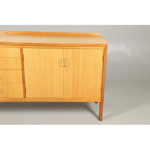 589 - MID CENTURY TEAK SIDEBOARD - MANN EGERTON, 1977. An interesting teak sideboard with a small raised b... 