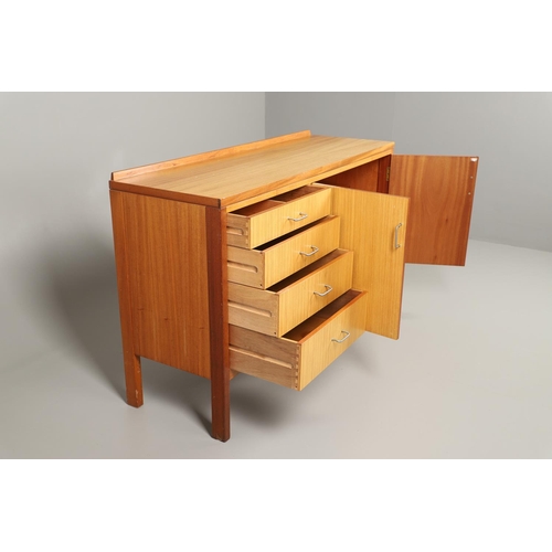 589 - MID CENTURY TEAK SIDEBOARD - MANN EGERTON, 1977. An interesting teak sideboard with a small raised b... 