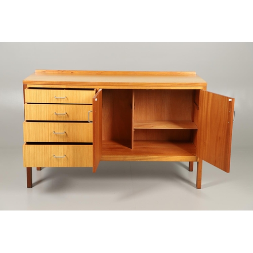 589 - MID CENTURY TEAK SIDEBOARD - MANN EGERTON, 1977. An interesting teak sideboard with a small raised b... 