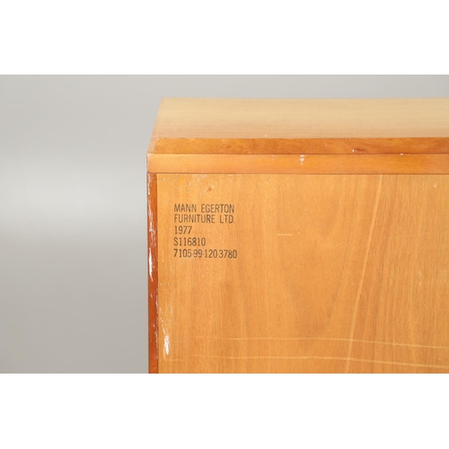 589 - MID CENTURY TEAK SIDEBOARD - MANN EGERTON, 1977. An interesting teak sideboard with a small raised b... 