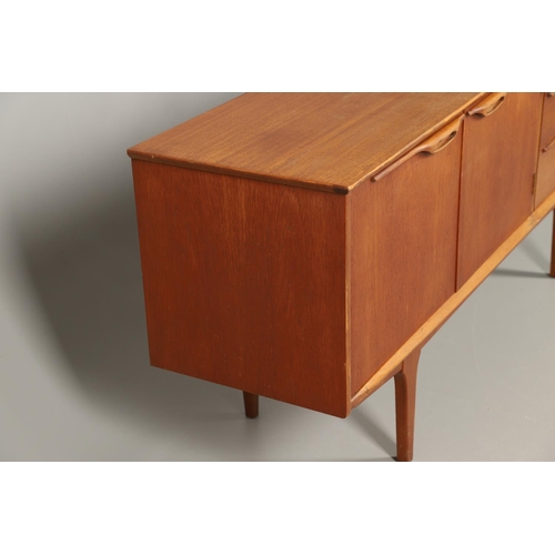 590 - MID CENTURY TEAK SIDEBOARD. Possibly by G Plan, with a large two door cupboard with internal shelf, ... 