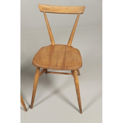 592 - TWO EARLY ERCOL STACKING DINING CHAIRS. Two circa 1950's light elm and beech stacking dining chairs,... 