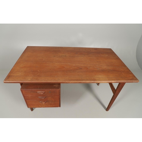 595 - DANISH MID CENTURY DESK - KAI KRISTIANSEN. A teak desk with a 'floating' top, supported on tapering ... 