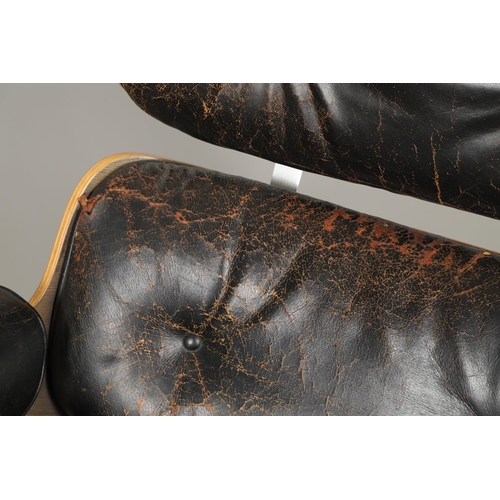 597 - CHARLES & RAY EAMES, LOUNGE CHAIR & OTTOMAN. Nos. 670 and 671, the wooden laminate shells covered wi... 