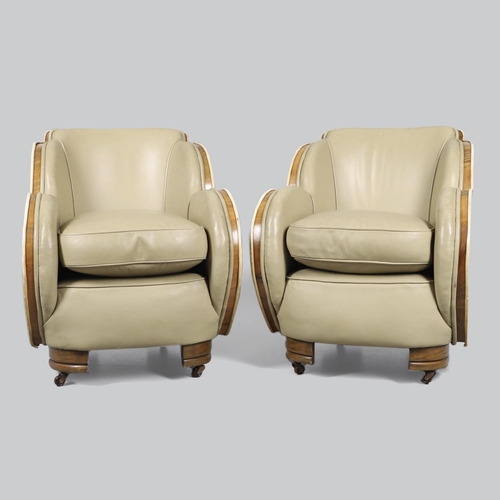 603 - PAIR OF ART DECO 'CLOUD BACK' LEATHER TUB CHAIRS. A pair of Art Deco walnut veneered tub chairs with... 