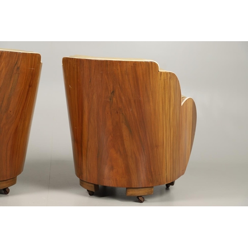 603 - PAIR OF ART DECO 'CLOUD BACK' LEATHER TUB CHAIRS. A pair of Art Deco walnut veneered tub chairs with... 