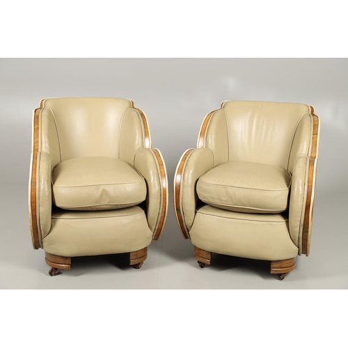 603 - PAIR OF ART DECO 'CLOUD BACK' LEATHER TUB CHAIRS. A pair of Art Deco walnut veneered tub chairs with... 