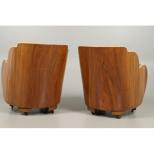 603 - PAIR OF ART DECO 'CLOUD BACK' LEATHER TUB CHAIRS. A pair of Art Deco walnut veneered tub chairs with... 