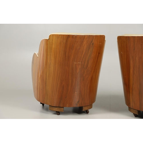 603 - PAIR OF ART DECO 'CLOUD BACK' LEATHER TUB CHAIRS. A pair of Art Deco walnut veneered tub chairs with... 