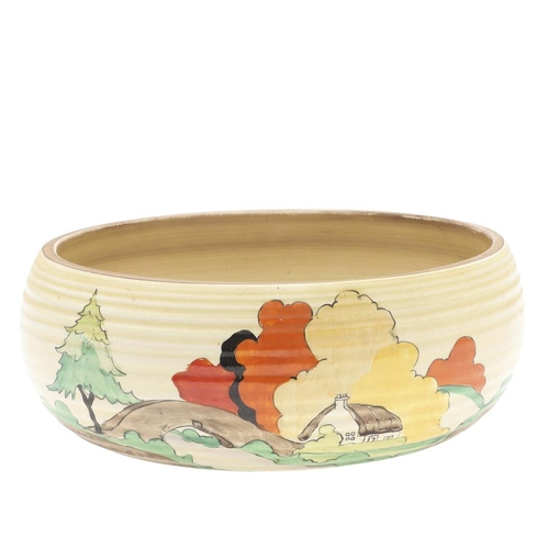 608 - CLARICE CLIFF ART DECO BOWL. A circular bowl painted with a cottage by a bridge and within a landsca... 