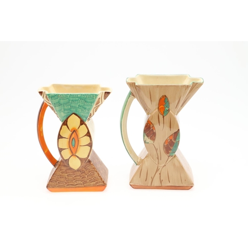 611 - MYOTT 'BOW TIE' ART DECO JUGS. Including three 'Bow Tie' jugs, each hand painted with a variety of f... 