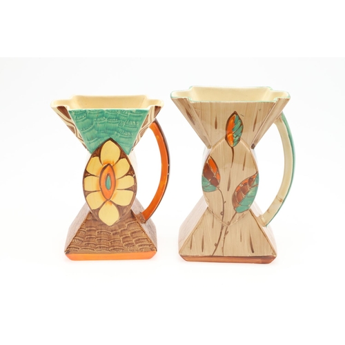 611 - MYOTT 'BOW TIE' ART DECO JUGS. Including three 'Bow Tie' jugs, each hand painted with a variety of f... 