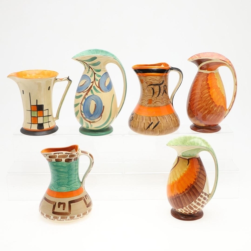 613 - MYOTT ART DECO JUGS. A variety of Myott jugs, each hand painted including three with curved handles ... 