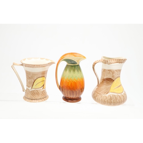 618 - VARIOUS MYOTT ART DECO JUGS. Seven various Myott jugs, each hand painted with a variety of floral de... 