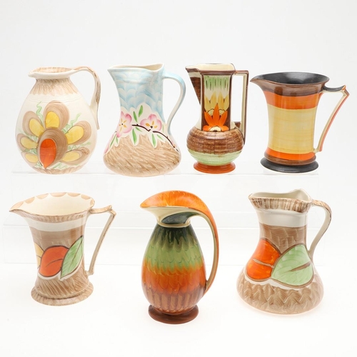 618 - VARIOUS MYOTT ART DECO JUGS. Seven various Myott jugs, each hand painted with a variety of floral de... 