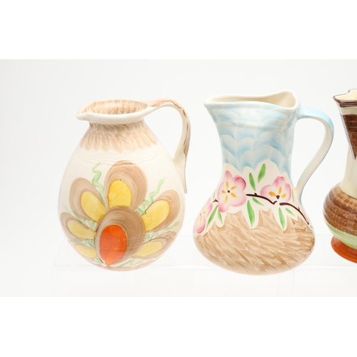 618 - VARIOUS MYOTT ART DECO JUGS. Seven various Myott jugs, each hand painted with a variety of floral de... 