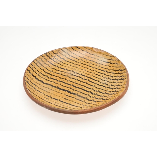 623 - EARLY ST IVES SLIPWARE DISH - STUDIO POTTERY. An early St Ives slipware pottery dish possibly by Ber... 