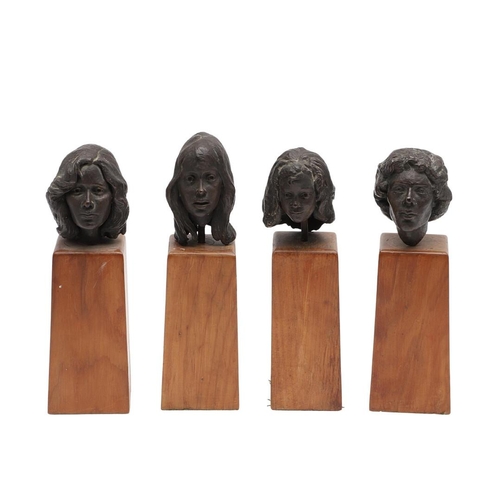 624 - SET OF BRONZE CONTEMPORARY BUSTS. A set of four small bronze busts of women, each mounted on  wooden... 