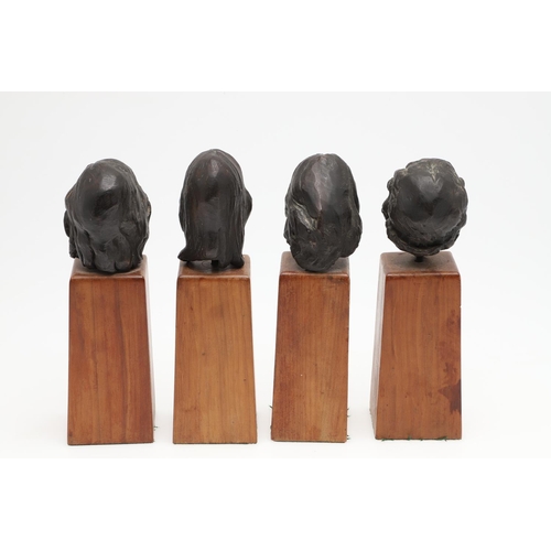 624 - SET OF BRONZE CONTEMPORARY BUSTS. A set of four small bronze busts of women, each mounted on  wooden... 