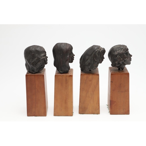 624 - SET OF BRONZE CONTEMPORARY BUSTS. A set of four small bronze busts of women, each mounted on  wooden... 