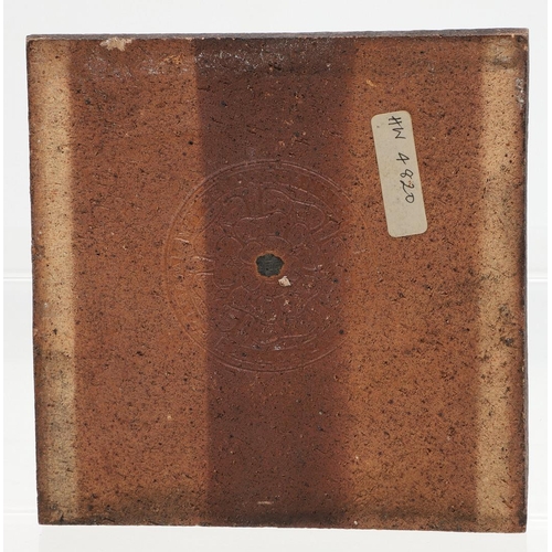 646 - WILLIAM DE MORGAN - TWO POTTERY TILES. Two floral designed square tiles, each with impressed marks t... 