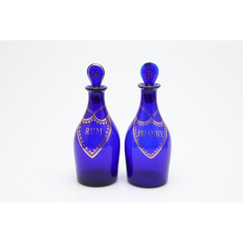 667 - 19THC RUM & BRANDY BLUE GLASS BOTTLES, & OTHER GLASSWARE. Two 19thc Rum and Brandy blue glass bottle... 