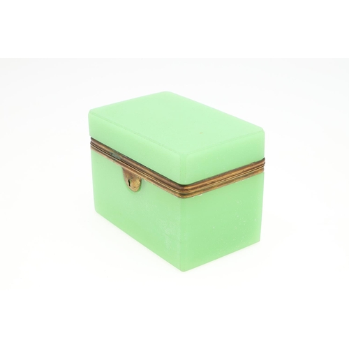 672 - ANTIQUE OPALINE GLASS CASKET. A rectangular shaped casket, with brass mounts around the rim and lock... 