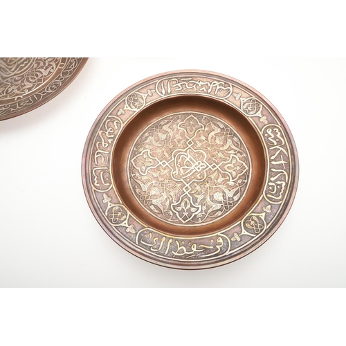 735 - SET OF PERSIAN COPPER & SILVER INLAID DISHES. Probably early 20thc, a set of six graduated copper di... 