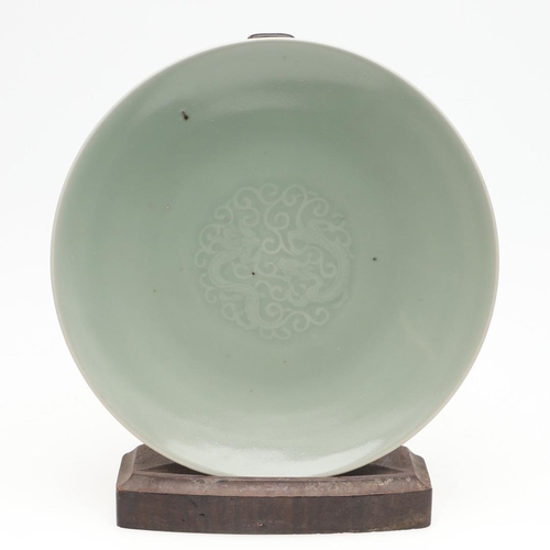 737 - 19THC CHINESE CELADON DISH. With a Qianlong seal mark but 19thc, with a short tapering foot and roun... 