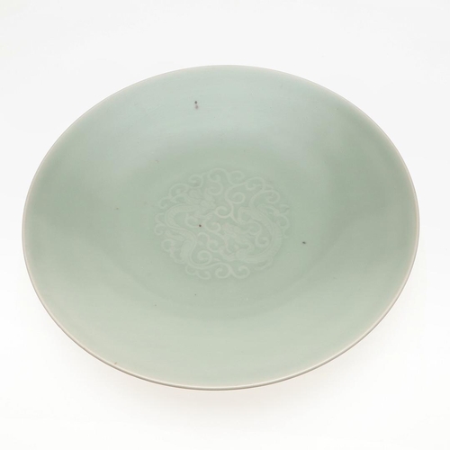 737 - 19THC CHINESE CELADON DISH. With a Qianlong seal mark but 19thc, with a short tapering foot and roun... 