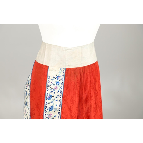 741 - ANTIQUE CHINESE SILK SKIRT. Probably late 19thc or early 20thc, the pleated red silk skirt with prin... 