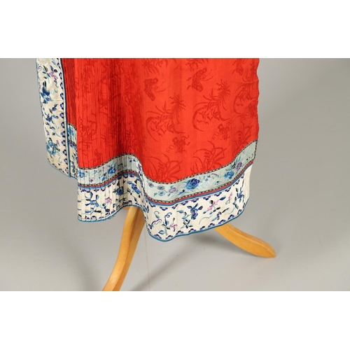 741 - ANTIQUE CHINESE SILK SKIRT. Probably late 19thc or early 20thc, the pleated red silk skirt with prin... 