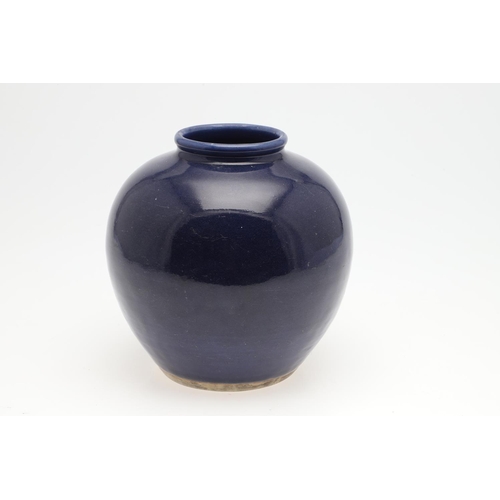 751 - 19THC CHINESE BLUE GLAZED VASE. A 19thc vase with rounded sides, with a plain dark blue glaze, the b... 