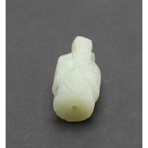 759 - CHINESE JADE FIGURE - SAGE. A miniature carved pale green jade figure of a Sage, with a pierced hole... 