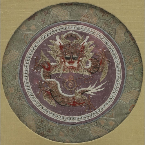 765 - CHINESE SILK EMBROIDERED PANEL. A circular purple silk panel, embroidered with silver metallic threa... 