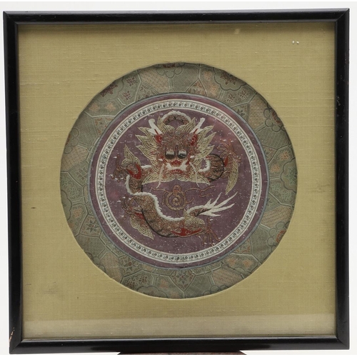 765 - CHINESE SILK EMBROIDERED PANEL. A circular purple silk panel, embroidered with silver metallic threa... 