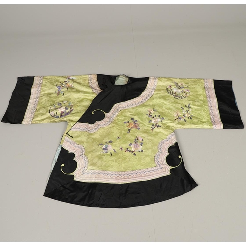 767 - CHINESE EMBROIDERED SILK ROBE. A 3/4 length robe, embroidered with flowers, birds and insects on gre... 