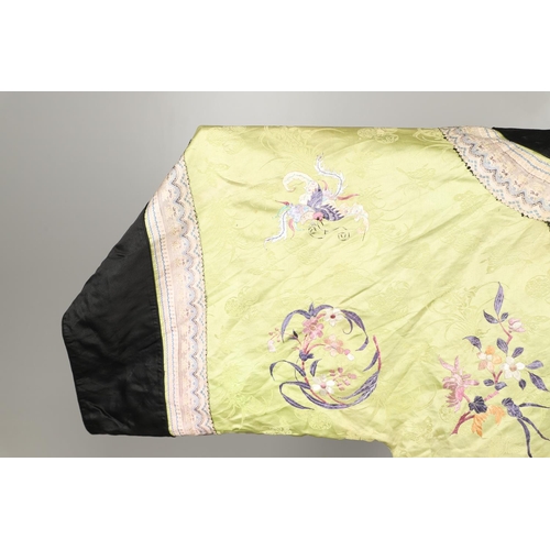 767 - CHINESE EMBROIDERED SILK ROBE. A 3/4 length robe, embroidered with flowers, birds and insects on gre... 