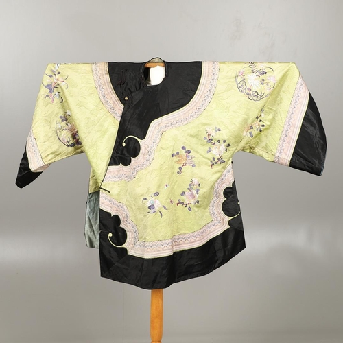 767 - CHINESE EMBROIDERED SILK ROBE. A 3/4 length robe, embroidered with flowers, birds and insects on gre... 