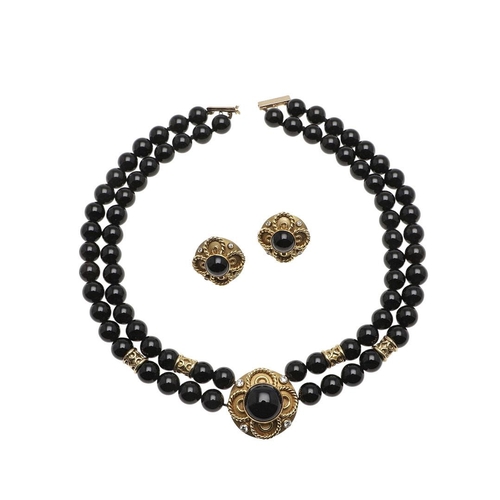 1003 - A BLACK ONYX, DIAMOND AND 18CT GOLD NECKLACE. formed as a double row of black onyx beads to an 18ct ... 