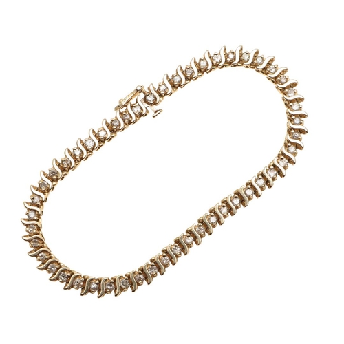 1007 - A DIAMOND LINE BRACELET. mounted with circular-cut diamonds, in 14ct yellow gold, with concealed cla... 