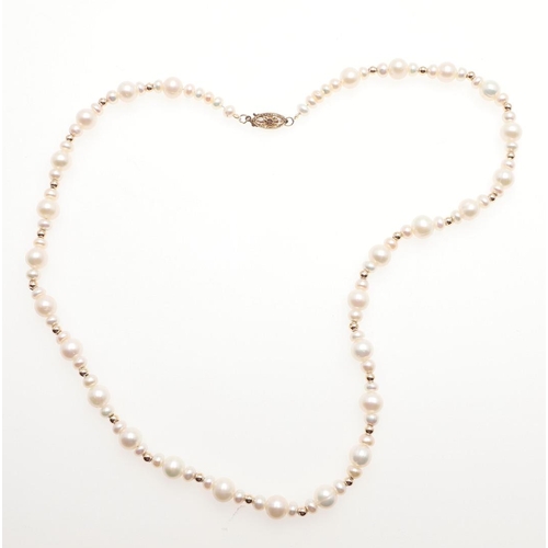 1011 - A CULTURED PEARL AND GOLD BEAD NECKLACE. mounted with cultured pearls measuring approximately 6.5mm,... 