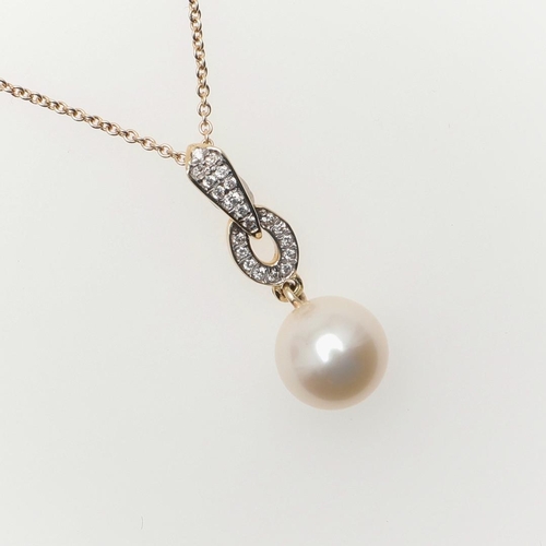 1013 - A CULTURED PEARL AND DIAMOND PENDANT. mounted with a cultured pearl measuring approximately 8.6mm, s... 