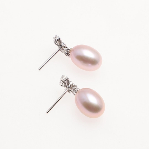 1016 - A PAIR OF CULTURED PEARL AND DIAMOND DROP EARRINGS. each earring mounted with a pink cultured pearl,... 