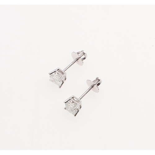 1018 - A PAIR OF DIAMOND STUD EARRINGS. set with princess-cut diamonds weighing 0.90 carats in total, set i... 