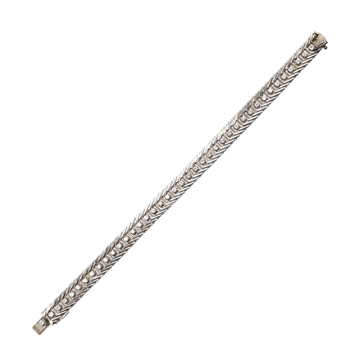 1020 - A DIAMOND AND GOLD LINE BRACELET. set with a row of circular-cut diamonds within a gold border, with... 