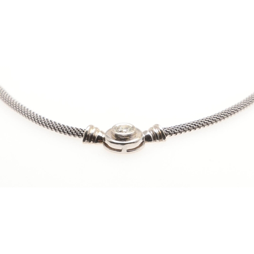 1021 - A DIAMOND AND 18CT WHITE GOLD NECKLACE. the circular brilliant-cut diamond mounted to the front in 1... 