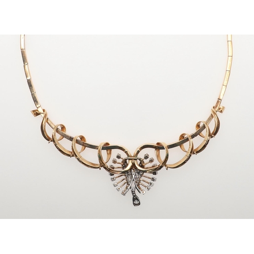 1022 - A DIAMOND AND GOLD NECKLACE. the centrepiece mounted with circular-cut diamonds, suspending a diamon... 